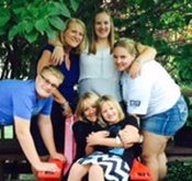 Portrait of Page West with family