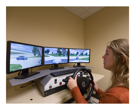 Woman in a driving simulator