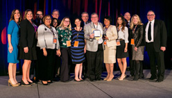 A group of Phillie award winners pose on stage with Senior Vice President for Philanthropy, Fred Najjar