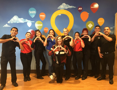 Employees at Dignity Health St. Rose Dominican's Pediatric Centers make the hand-heart gesture