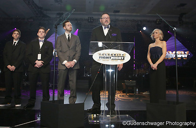 Speakers on stage share stories at Celebrity Fight Night