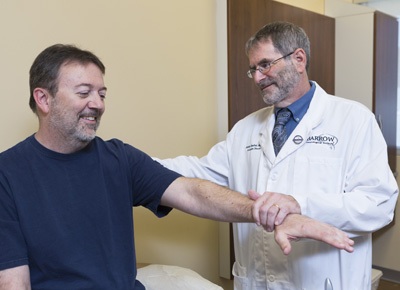 Dr. Jeremy Shefner with a patient